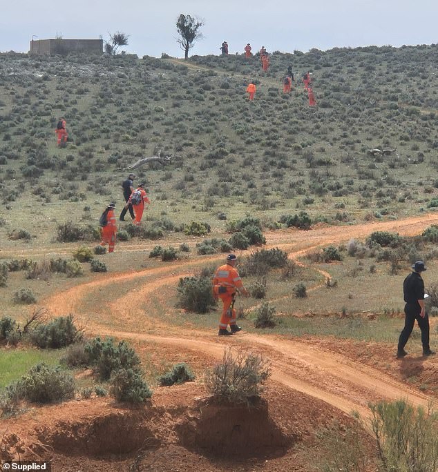 Police called off the widespread search for the four-year-old on Friday (pictured, searchers at the scene)