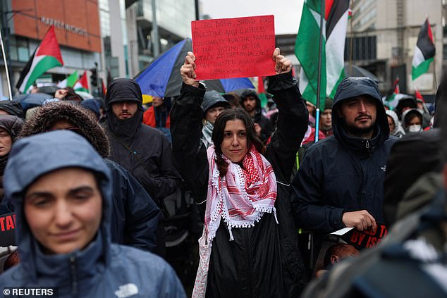 People take part in a demonstration organised by GM Friends of Palestine at Manchester Cathedral on Saturday
