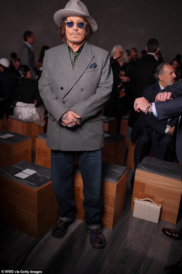 As he makes a slow return to the spotlight, Johnny attended the French luxury brand's catwalk in the capital