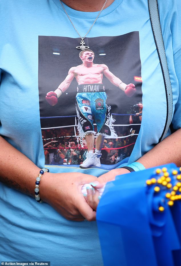 A fan with an photograph of Ricky Hatton on a shirt ahead of his funeral in Manchester today