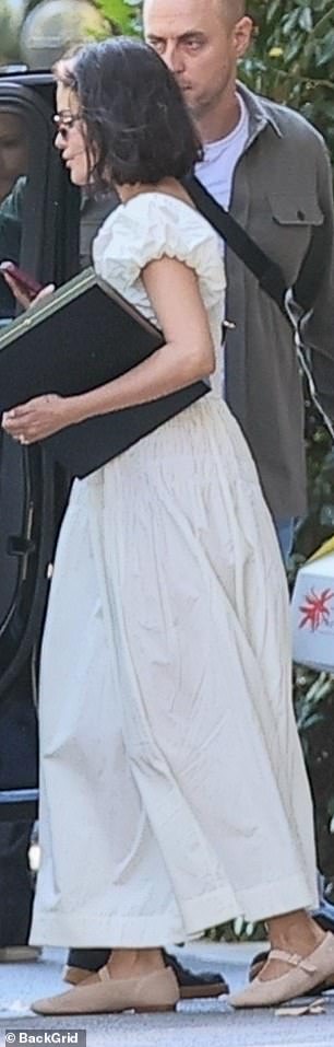 She propped on a pair of trendy sunglasses for the outing