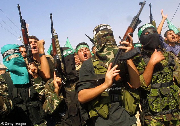 Hamas fighters (file photo). 'They will disarm ¿ and if they don't I'm gonna make them disarm,' the president told reporters at the White House on Tuesday. 'They know what I mean.'