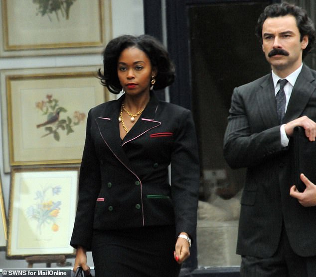 Nafessa Williams, who plays Cameron Cook, was back in her power suit to shoot scenes alongside Aidan
