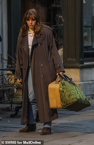 Bella Maclean, who plays Taggie, was dressed in a dark trench coat and jeans