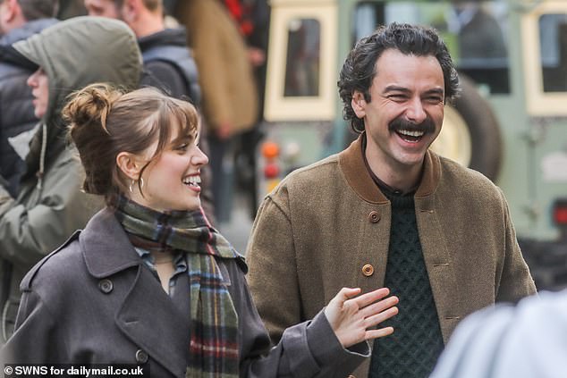 The pair were wrapped up against the cold in their winter coats and scarves