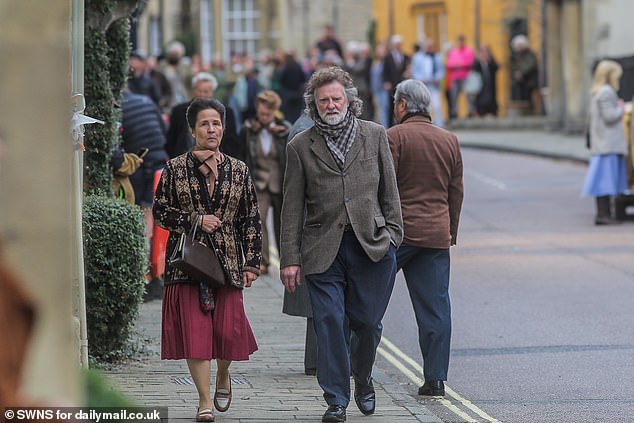 Extras flooded the high street, looking the part in vintage looks
