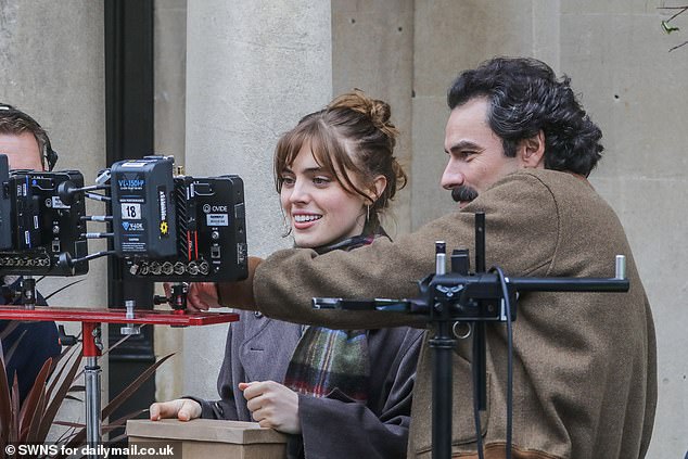 Aidan and Bella were seen checking out the takes behind the camera