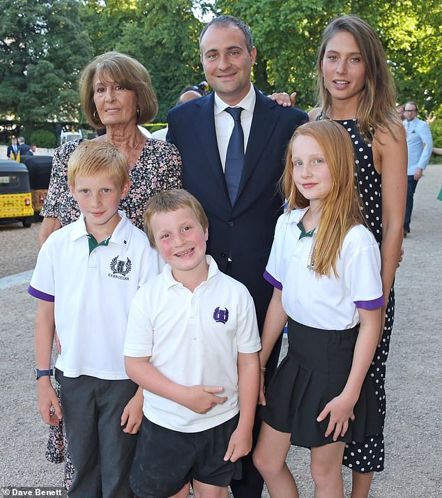 Lady Annabel Goldsmith, son Ben and daughter-in-law Jemima Jones pose with their first three children in 2015. Iris, front right, would later die in an accident on the family farm