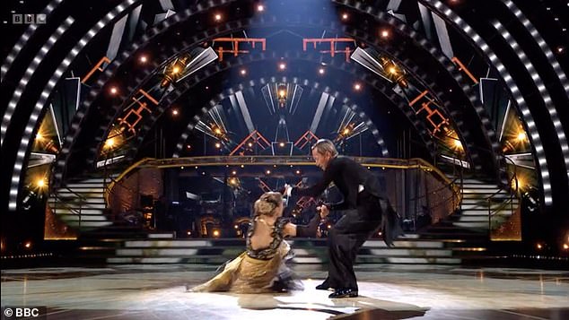 Just before the routine came to an end, Karen lost her footing on her dress during a spin, causing her to slip