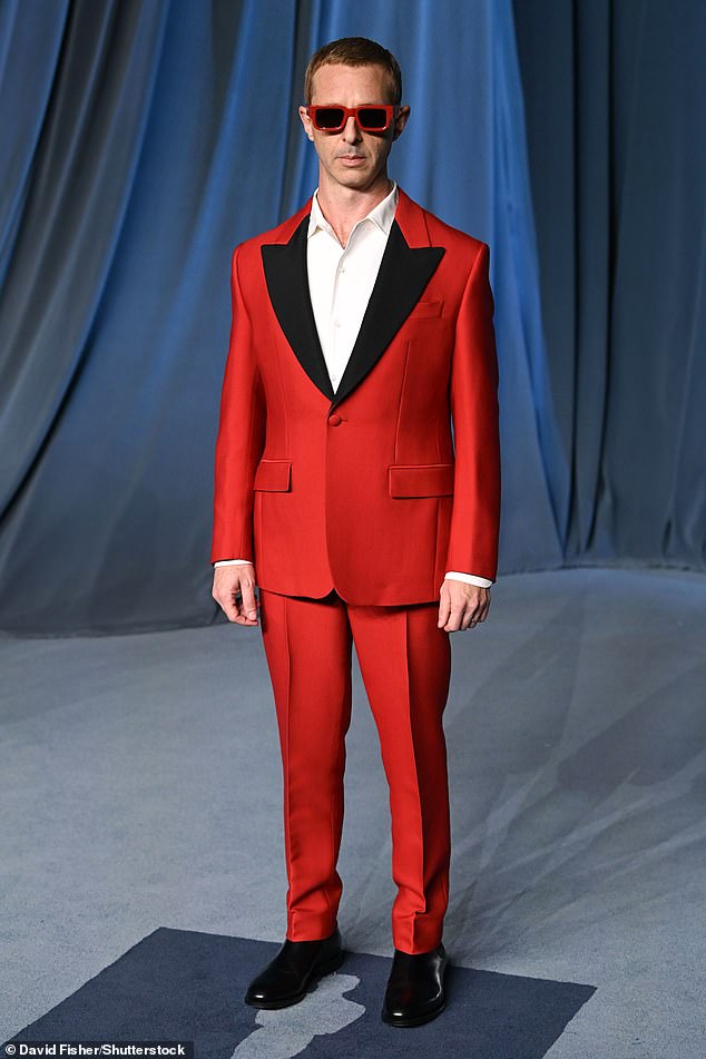 Succession star Jeremy Strong made a statement in an eye-catching red suit as well as red-rimmed shades