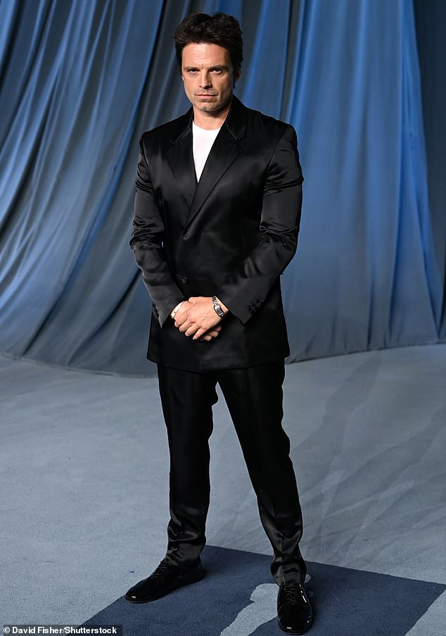 Sebastian Stan donned a satin black suit and added a plain white shirt underneath for a casual flare