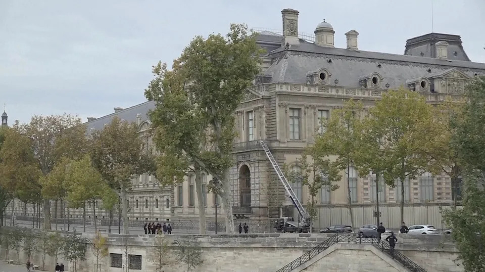 This grab taken from video shows police standing outside the Louvre museum, Sunday, Oct. 19, 2025, in Paris. / Credit: AP Photo