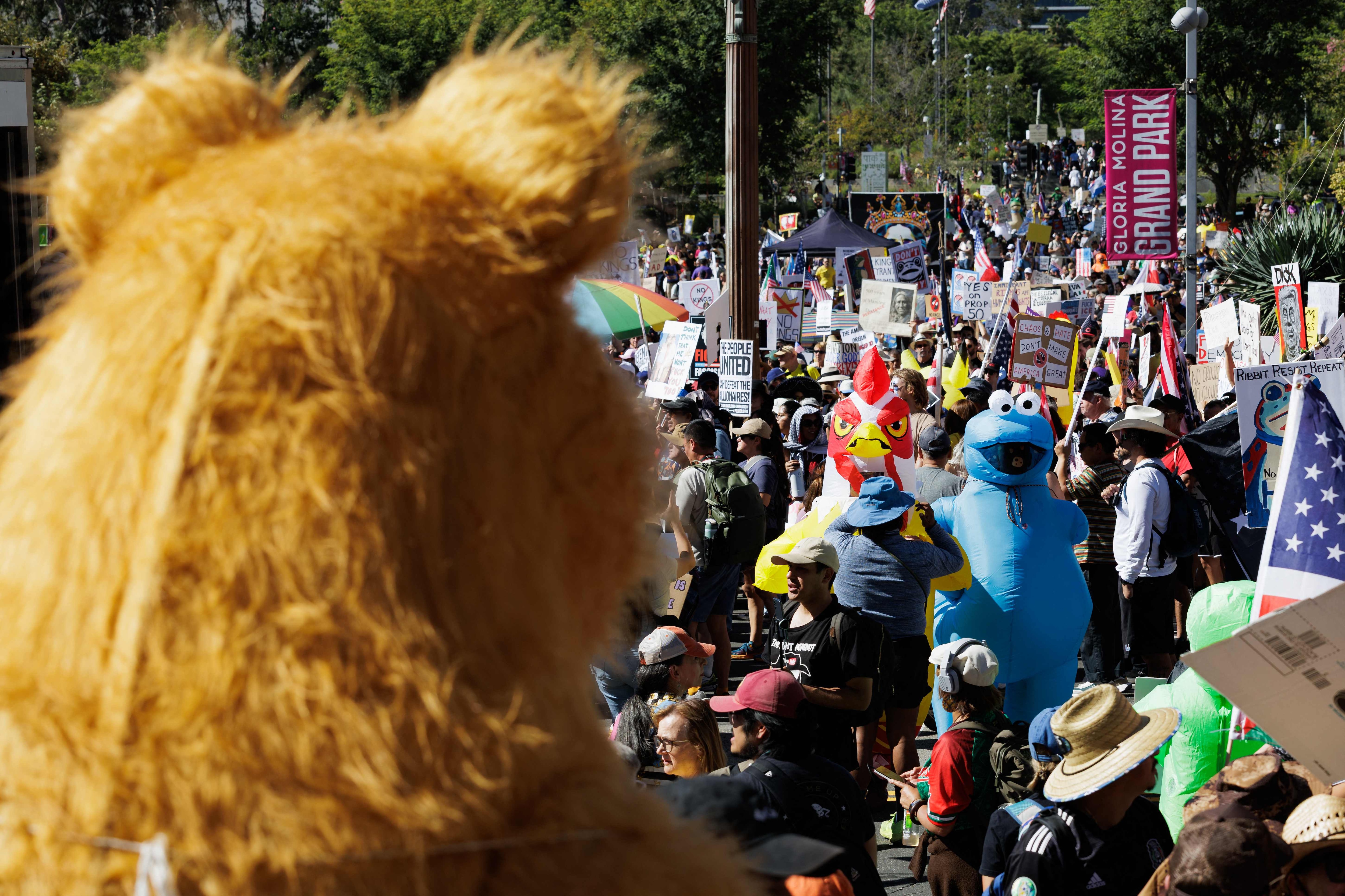 LOS ANGELES, CALIFORNIA - OCTOBER 18: Thousands of protesters gather outside Los Angeles City Hall, many of them wearing inflatable costumes, at the "No Kings" protest on October 18, 2025 in Los Angeles, California. Organizers expect millions to participate in cities and towns across the nation for the second "No Kings" protest to denounce the Trump administration. Caylo Seals/Getty Images/AFP (Photo by Caylo Seals / GETTY IMAGES NORTH AMERICA / Getty Images via AFP)(Getty Images via AFP) LOS ANGELES, CALIFORNIA - OCTOBER 18: Thousands of protesters gather outside Los Angeles City Hall, many of them wearing inflatable costumes, at the "No Kings" protest on October 18, 2025 in Los Angeles, California. Organizers expect millions to participate in cities and towns across the nation for the second "No Kings" protest to denounce the Trump administration. Caylo Seals/Getty Images/AFP (Photo by Caylo Seals / GETTY IMAGES NORTH AMERICA / Getty Images via AFP)(Getty Images via AFP)