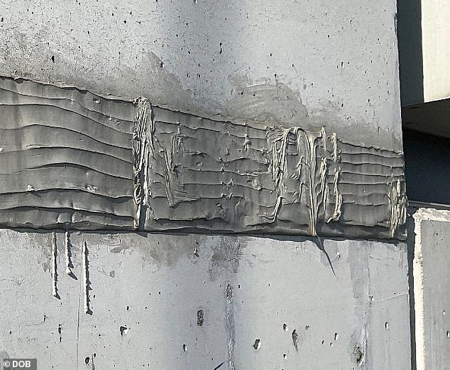 An ugly-looking repair marks the pristine concrete exterior of 432 Park Avenue in a photograph shot by New York City's Department of Buildings in early 2023