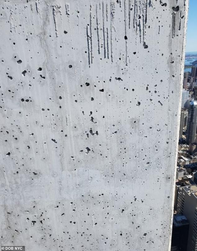 Pockmarked concrete is pictured in January 2023. Building inspectors described them as 'surface voids'