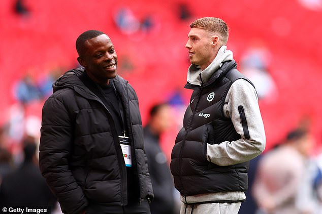 Many of the players playing for Wythenshawe FC Vets have held coaching and punditry roles since their playing days, while Onuoha (left) works for Man City as an ambassador