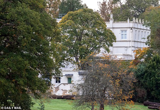 Crumbling paintwork, cracks and mould on the exterior of Royal Lodge, pictured yesterday