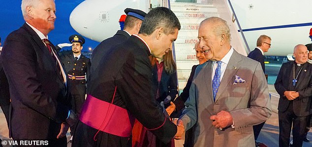 Britain's King Charles greets a member of the clergy as he arrives in Rome to undertake a historic State Visit to the Holy See Their Majesties will join His Holiness Pope Leo XIV to celebrate the 2025 Jubilee year, in Rome, Italy, October 22, 2025.  Arthur Edwards/Pool via REUTERS