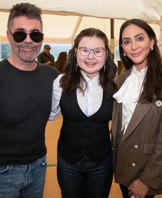 However, pictures of Lauren taken three weeks ago at the Great Ormond Street Hospital clay pigeon shoot reveal she is not wearing a wedding ring (Pictured), just the diamond sparkler Simon proposed with in 2021