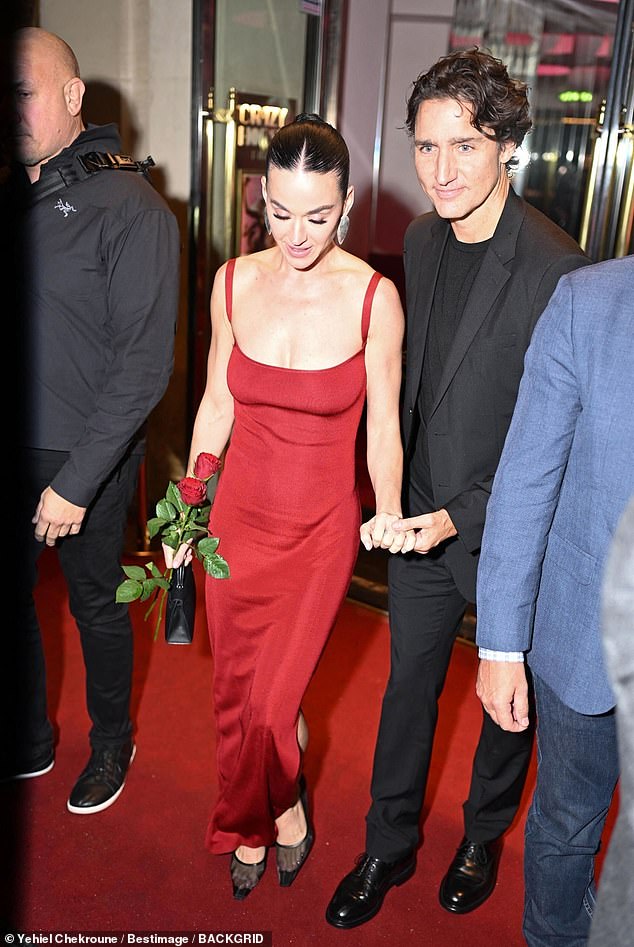 The couple made their way to a chauffeured vehicle