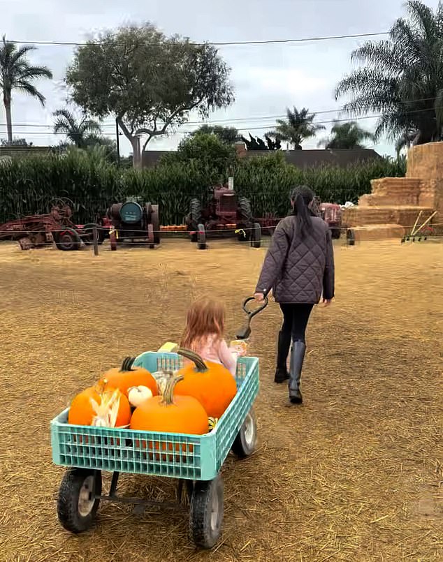 Other moments see Meghan pat her son's head and lead her daughter through the farm on a trailer