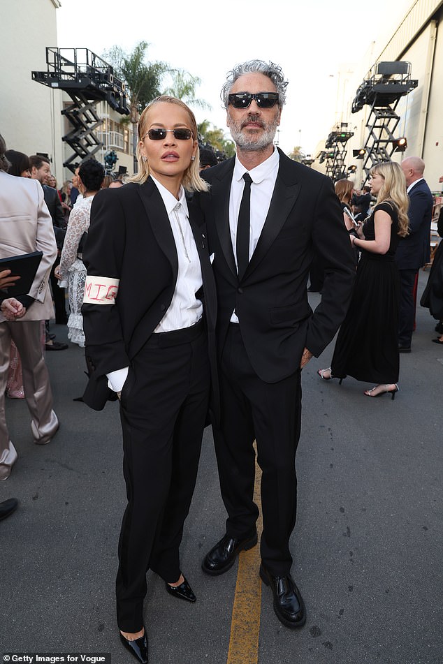 Joining a star-studded turnout at the runway event, the singer opted for a chic black trouser suit as she headed to Paramount Studios for the show