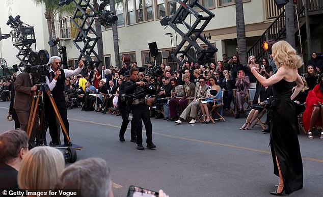 The live audience was transported into the world of Hollywood filmmaking as more set equipment flashed by them - with the director calling out that they needed to get ready for the next shot