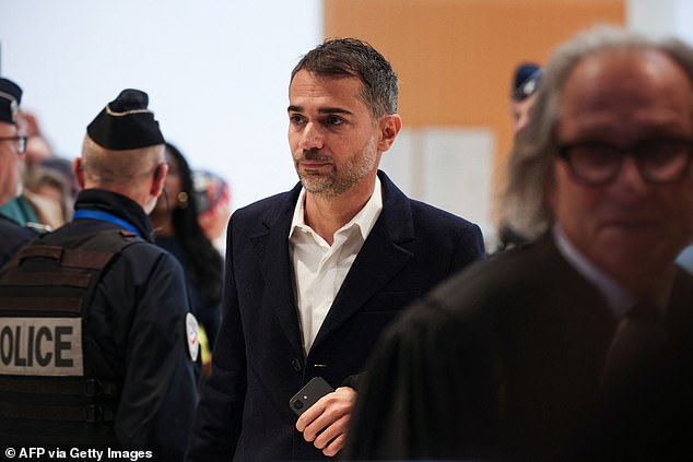 French author Aurelien Poirson-Atlan also known as Zoe Sagan arrives for his trial with nine other persons accused of sexist cyber-harassment of Brigitte Macron