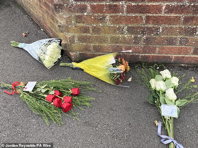 Four bunches of flowers were placed near the police cordon, while another was left by a local woman from a neighbouring road