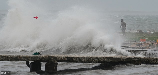 Waves splash in Kingston, Jamaica, as Hurricane Melissa approaches, Tuesday, Oct. 28, 2025. (AP Photo/Matias Delacroix)