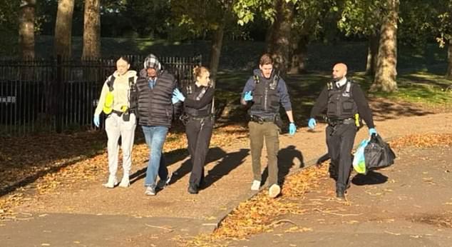 This is the moment Kebatu (second from left) was arrested by Met Police officers in Finsbury Park, north London