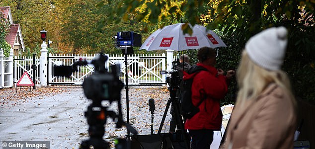 WINDSOR, ENGLAND - OCTOBER 31: Members of the media gather outside the gates to Royal Lodge following the announcement that Andrew Mountbatten Windsor will have to surrender the lease on the property, on October 31, 2025 in Windsor, England. King Charles III has started the formal process of removing the Titles, Styles and Honours of his brother, who will now be known as Andrew Mountbatten Windsor. Mr Mountbatten Windsor will also surrender the lease on Royal Lodge, where he has lived since 2004, and move to private accommodation. The historic move follows allegations of sexual abuse linked to the former prince's relationship with child sex offender Jeffrey Epstein. (Photo by Peter Nicholls/Getty Images)
