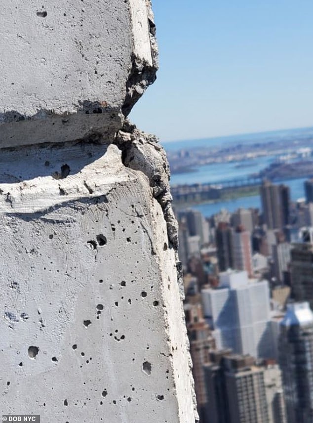 Cracks are seen on the concrete facade of the 40th floor of 432 Park Avenue in January 2023