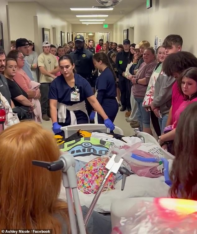 Cheerleader, 18, is wheeled through packed hospital to donate her The lines of people seemed almost endless as she passed through the hospital, many of those who gathered had tears in their eyes