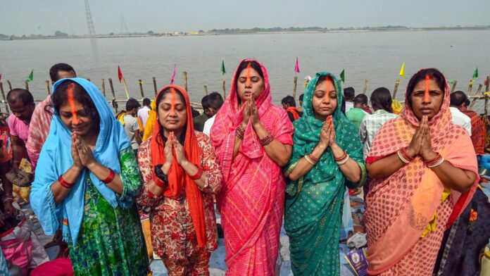 Chhath Puja 2025: Top 50 wishes, WhatsApp messages, images, GIFs Devotees perform rituals on the banks of the River Ganga during the Chhath Puja festival in Patna