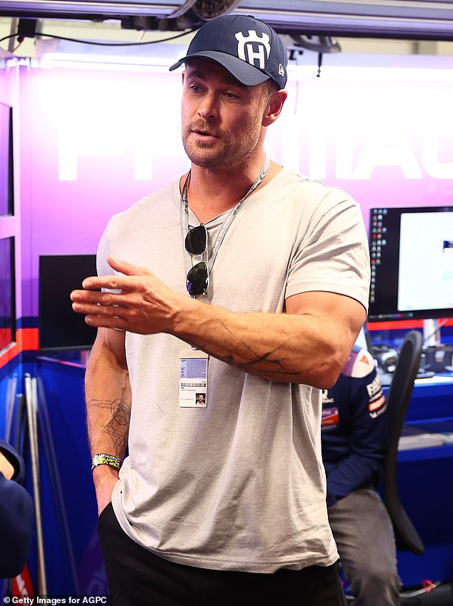 Chris Hemsworth shows off his bulging biceps in tight T-shirt Chris Hemsworth (pictured) enjoyed a solo outing to the MotoGP Grand Prix at Phillip Island on Friday