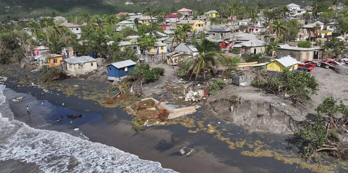 Haiti river bank bursts killing 25 and leaving dozens trapped as Hurricane Melissa's deadly rampage continues: Live updates