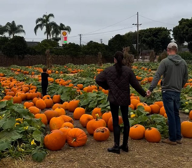 Meghan Markle shares sweet video of Archie, six, and four-year-old In the footage Meghan dons a pair of black knee-high boots and leggings with a black jacket while Harry opts for a causal look in jeans, a hoodie and a baseball cap. The pair can be seen holding hands