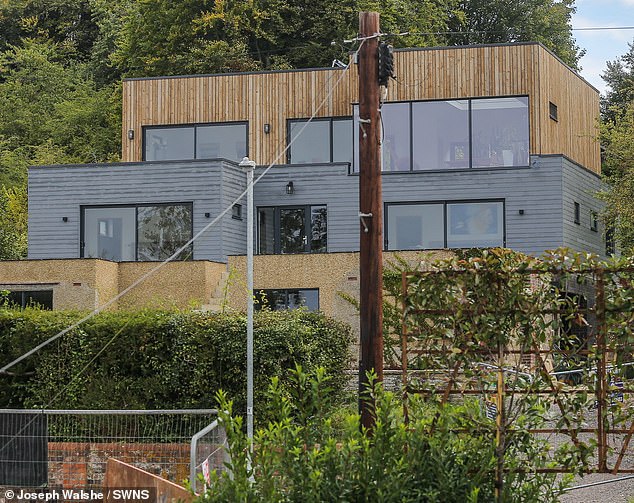 Pictured: The newly installed lamppost outside Stuart Hunt's £2.3million property in Goring-on-Thames. His new driveway is seen on the right