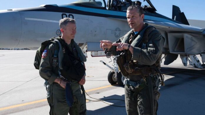 Pete Hegseth experiences jaw-dropping aerial rolls on high-speed F/A-18 Super Pete Hegseth, 45, flew alongside Joint Chiefs of Staff Chairman Gen. Dan Caine, who piloted his own F-16 fighter jet during the event at Naval Air Station (NAS) Fallon, about an hour east of Reno. (Image: @Secretary of War Pete Hegseth/X)