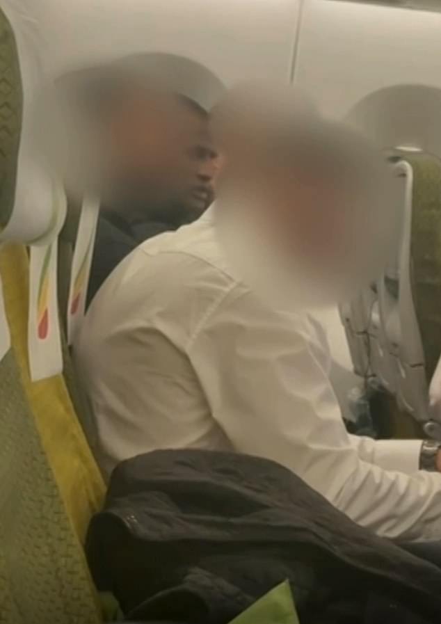 Kebatu pictured on the plane to Ethiopia as he is deported with no right to return to the UK