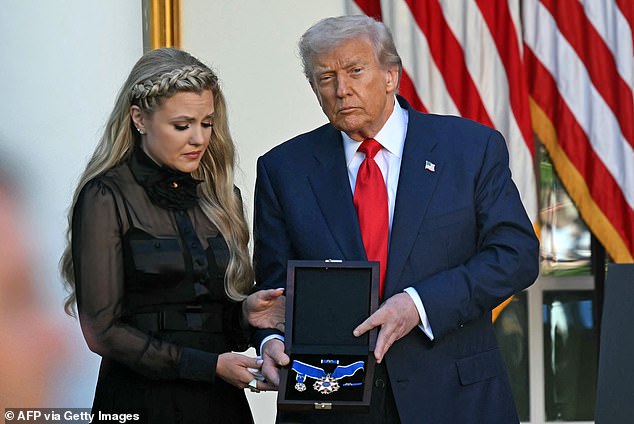 US President Donald Trump and Erika Kirk (L), Charlie Kirk's widow, participate in a Medal of Freedom Ceremony for late US right-wing activist Charlie Kirk in the Rose Garden