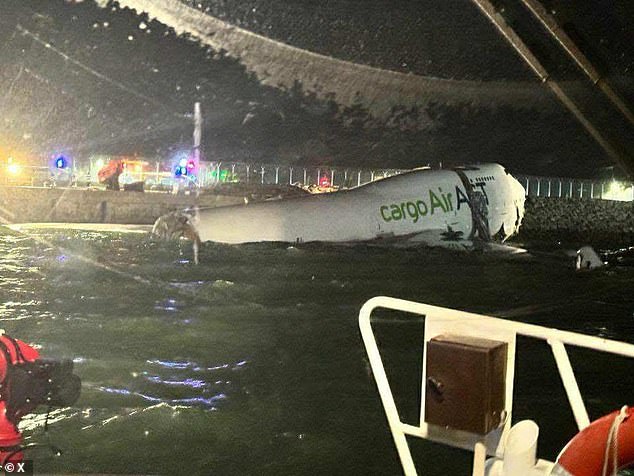 Two dead after plane runs off runway and ploughs into One person has been killed after a cargo plane from Dubai slid off the runway and plunged into the sea immediately after landing at Hong Kong International Airport