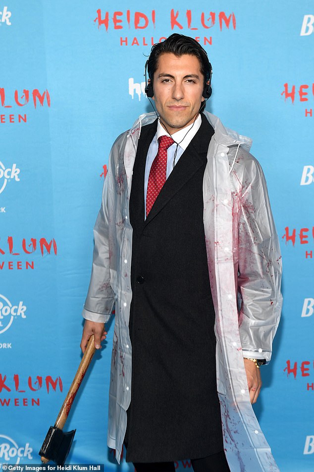 Jason Tartick also attended the party, as he seemed to get creative as an axe murderer. He held a fake axe in one hand, and wore a plastic raincoat that was covered in fake blood. He also wore a pair of headphones