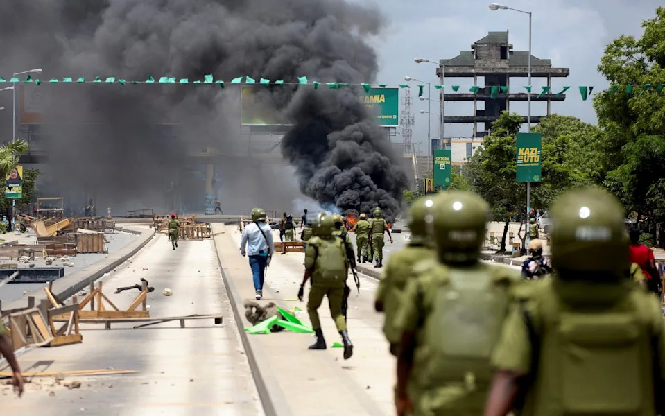 Tanzanian riot police disperse demonstrators during violent protests