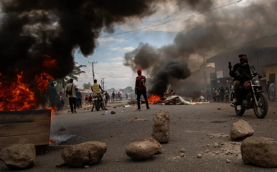 People protest in the streets of Arusha, Tanzania, on election day, October 29, 2025