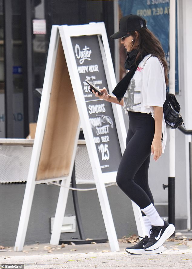 She was seen scrolling through her phone at one point during the outing