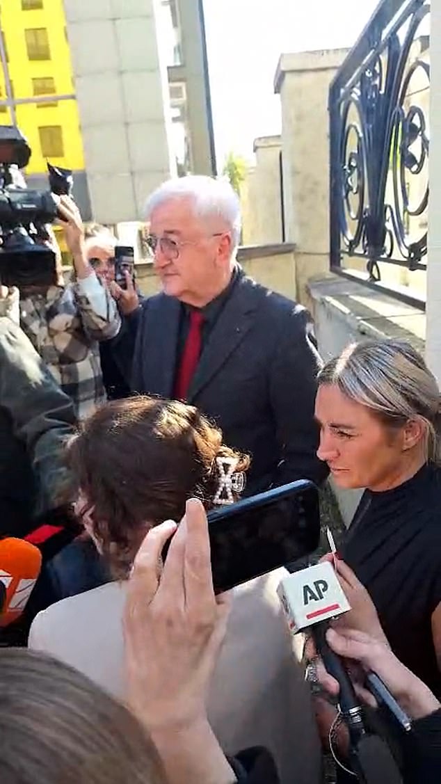 The teenager was surrounded by journalists she she walked free