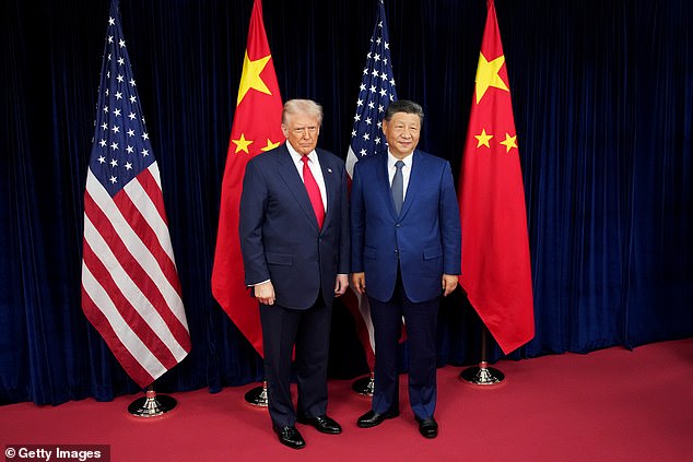 US President Donald Trump and Chinese President Xi Jinping pose for photos ahead of a bilateral meeting at Gimhae Air Base on October 30, 2025 in Busan, South Korea. Trump is meeting Xi for the first time since taking office for his second term, following months of growing tension between both countries