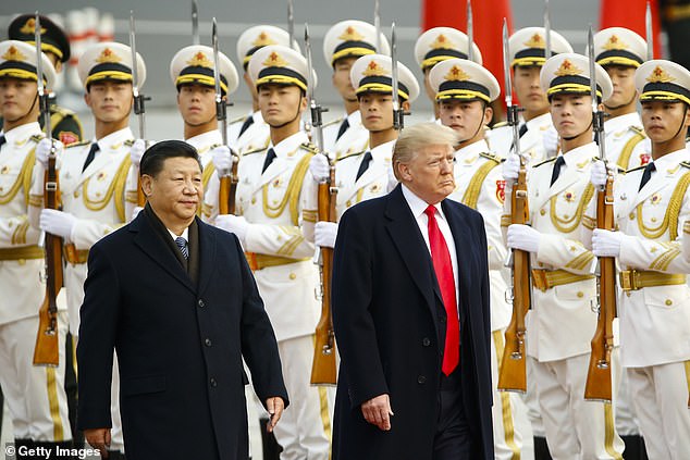 Trump takes part in a welcoming ceremony with Xi Jinping on November 9, 2017 in Beijing, China on a 10-day trip to Asia